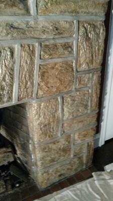 Fireplace had been painted pure white. Instead of stripping it down to bare stone, we painted it to look like the original stone using colors from the stone and mortar in the adjacent sun room Jenkintown, PA